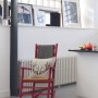 Dehavilland Studios, East London | Detail of re-painted rocking chair in main kitchen | Interior Designers